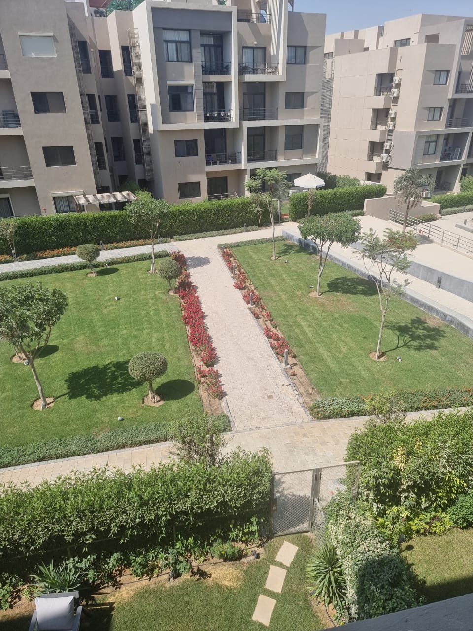 fifth-square-apt-143-8 Garden and walkway seen from the balcony - apartment in Fifth Square, New Cairo