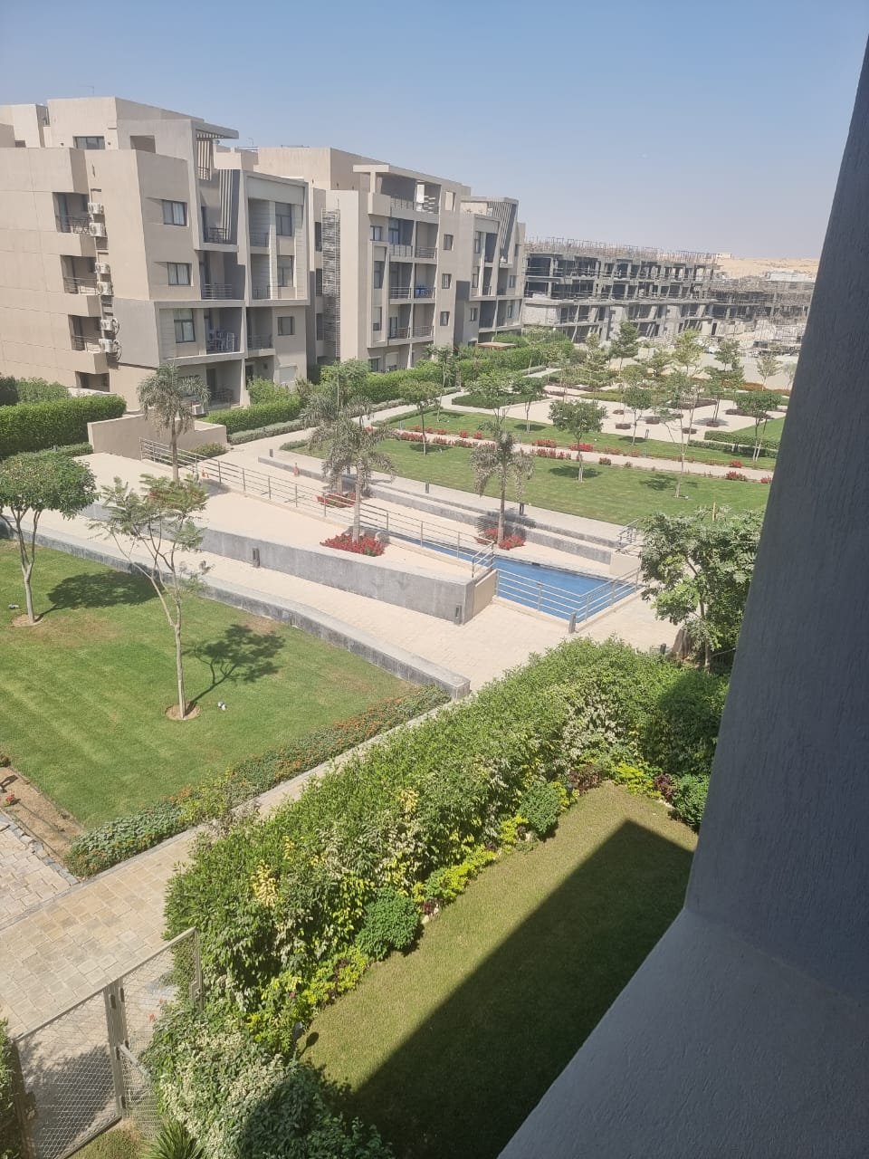 fifth-square-apt-143-9 Garden and pool seen from the balcony - apartment in Fifth Square, New Cairo