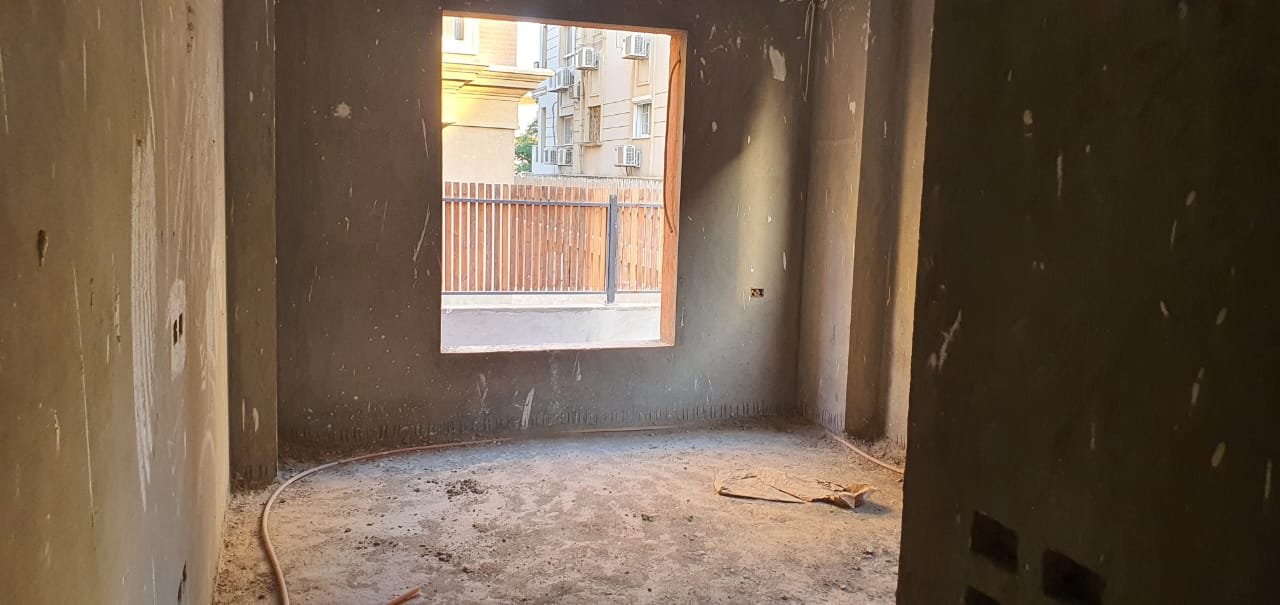 gharb-golf-apt-260-08 Unfinished room with a window facing a wooden fence - apartment in Gharb Golf 5th Settlement