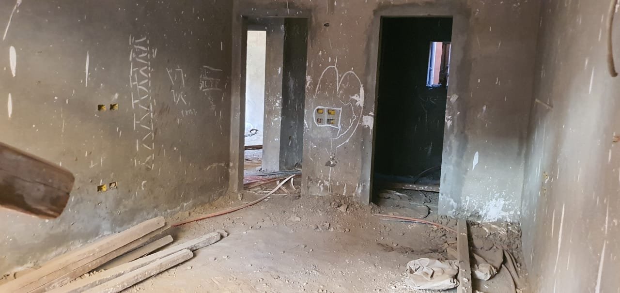 gharb-golf-apt-260-10 Rough unfinished room with two doorways and building debris - apartment in Gharb Golf 5th Settlement