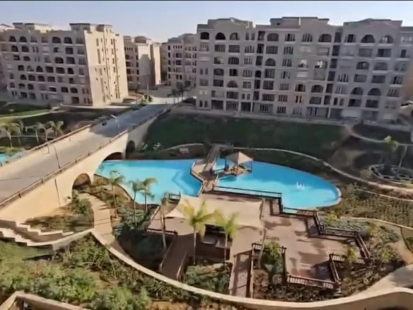 Green Square compound pool and gardens aerial view - حمام سباحة ومساحات خضراء بكمبوند جرين سكوير 103-01