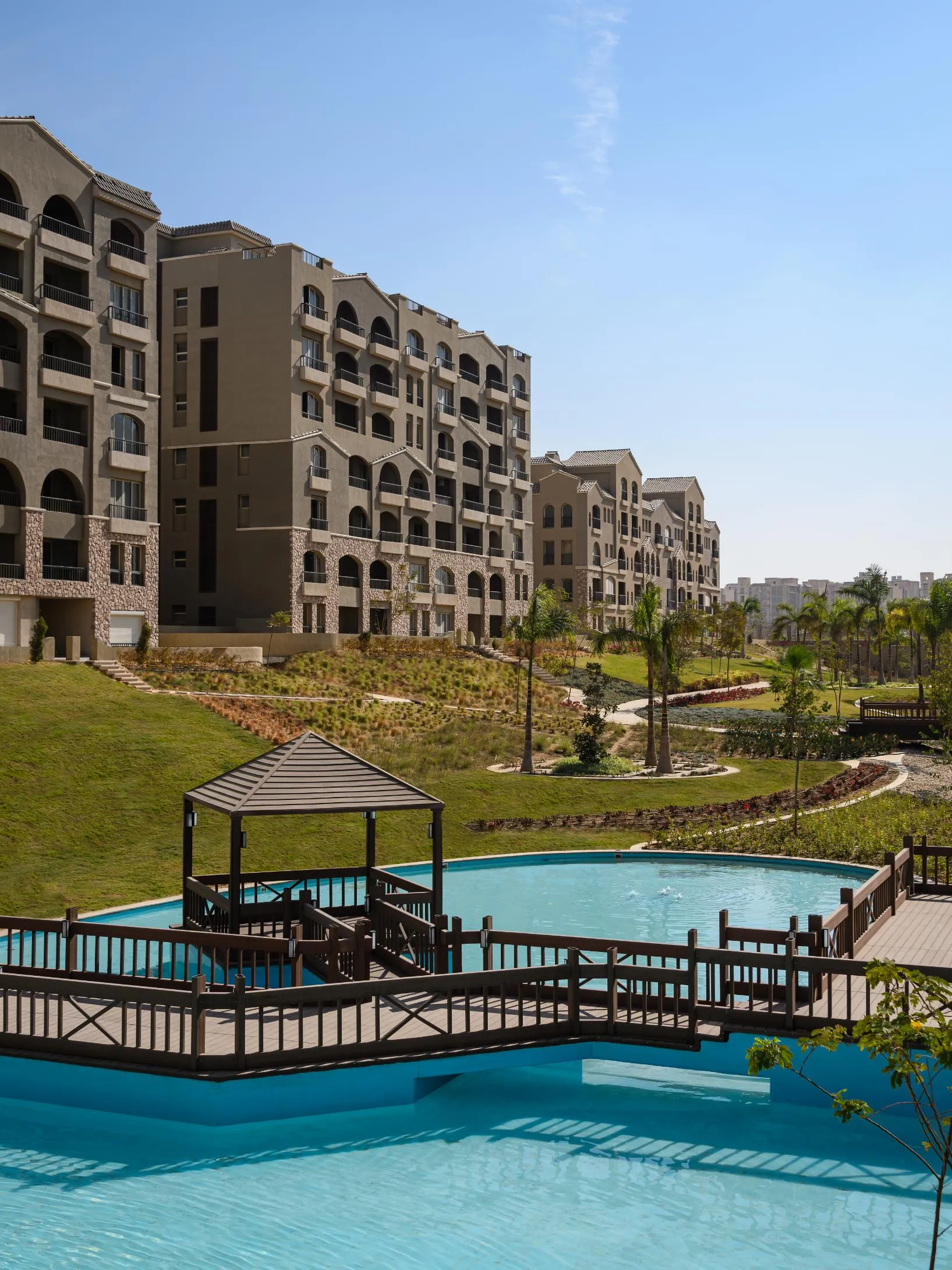 Swimming pool and residences at Green Square, Mostaqbal City | حمام سباحة ومباني جرين سكوير، المستقبل سيتي