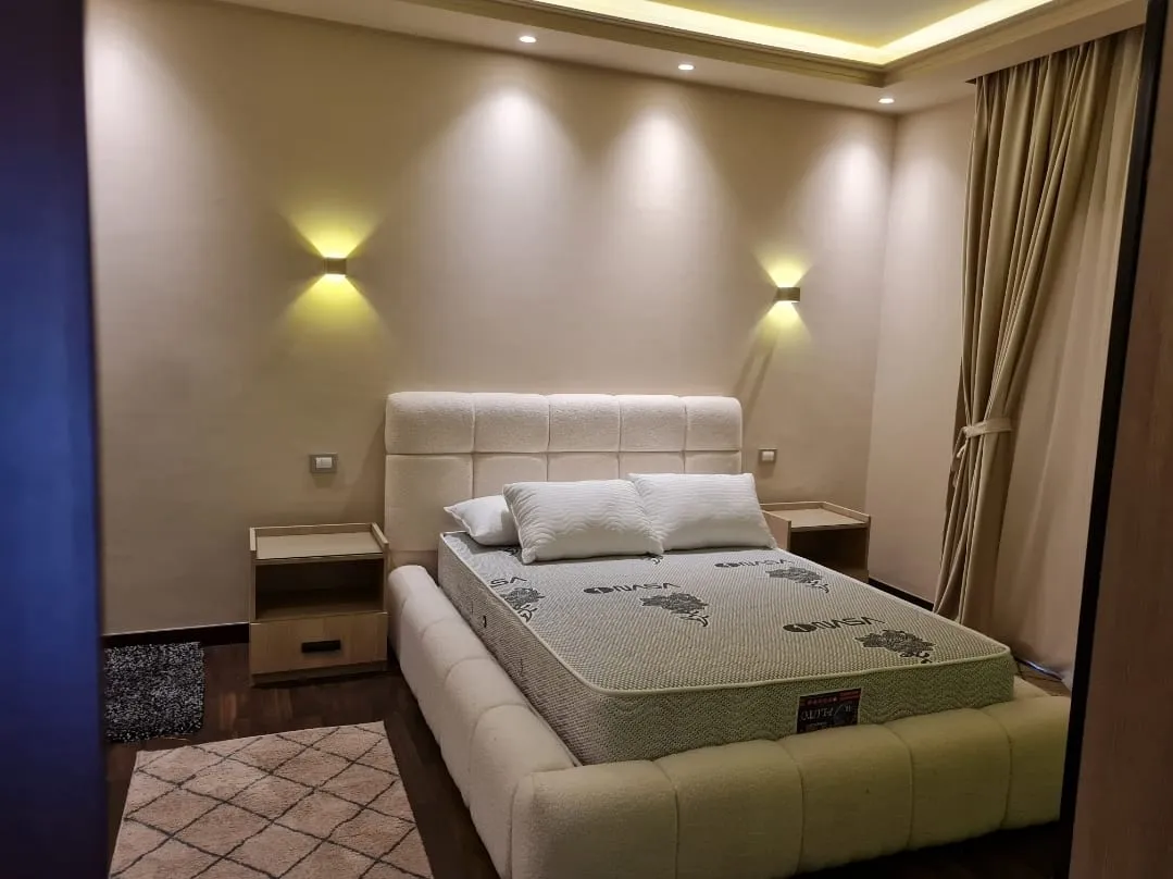 Bedroom with wall lights - studio in Hyde Park, New Cairo