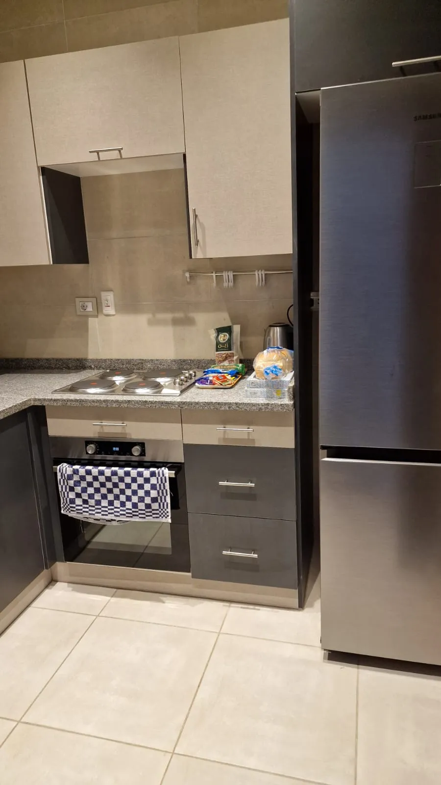 Kitchen with fridge and cooker - studio in Hyde Park, New Cairo