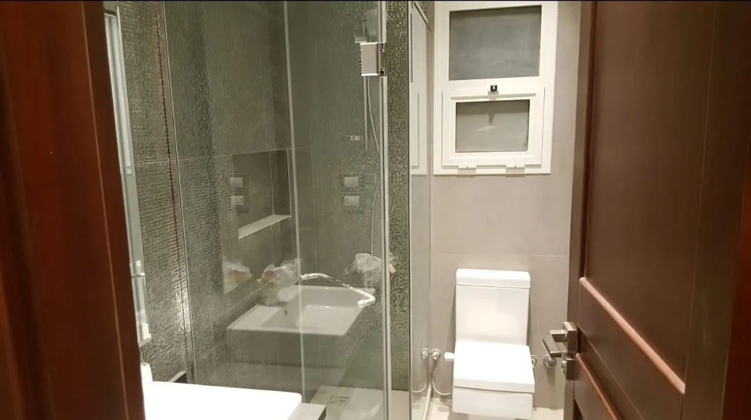 Bathroom with glass shower and toilet - studio in Hyde Park, New Cairo