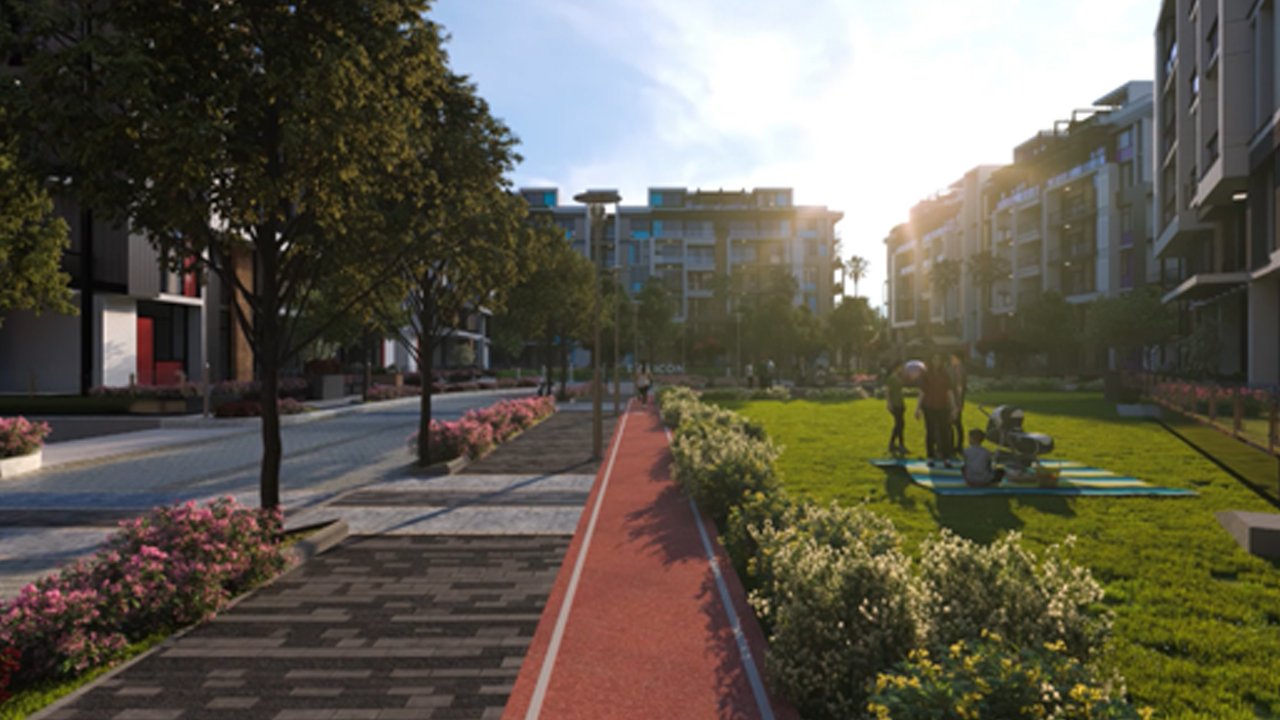 Rendering of a tree-lined road beside a red jogging track and lawn - apartment in The Icon Gardens, 5th Settlement