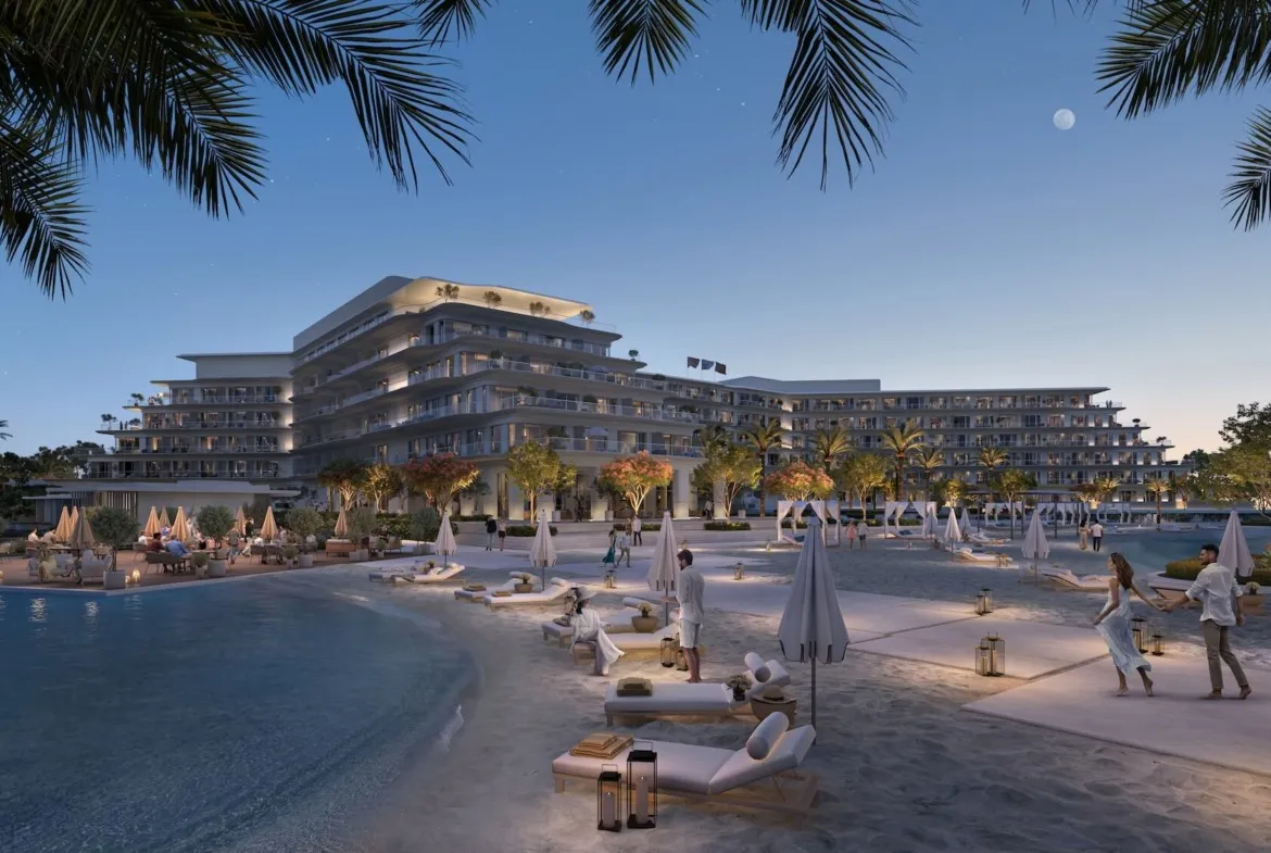 Lagoon beachfront with a hotel-style building at dusk - hotel apartment in Soul by Emaar, North Coast
