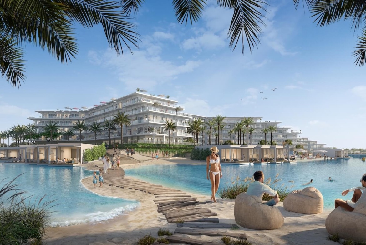 Daytime lagoon beach with beanbags and white villas - hotel apartment in Soul by Emaar, North Coast