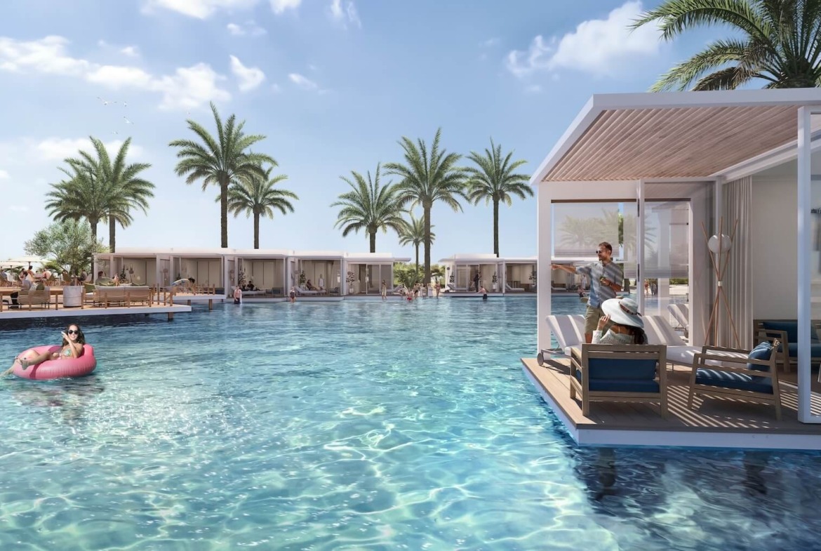 Floating cabana in a lagoon pool with swimmers - hotel apartment in Soul by Emaar, North Coast