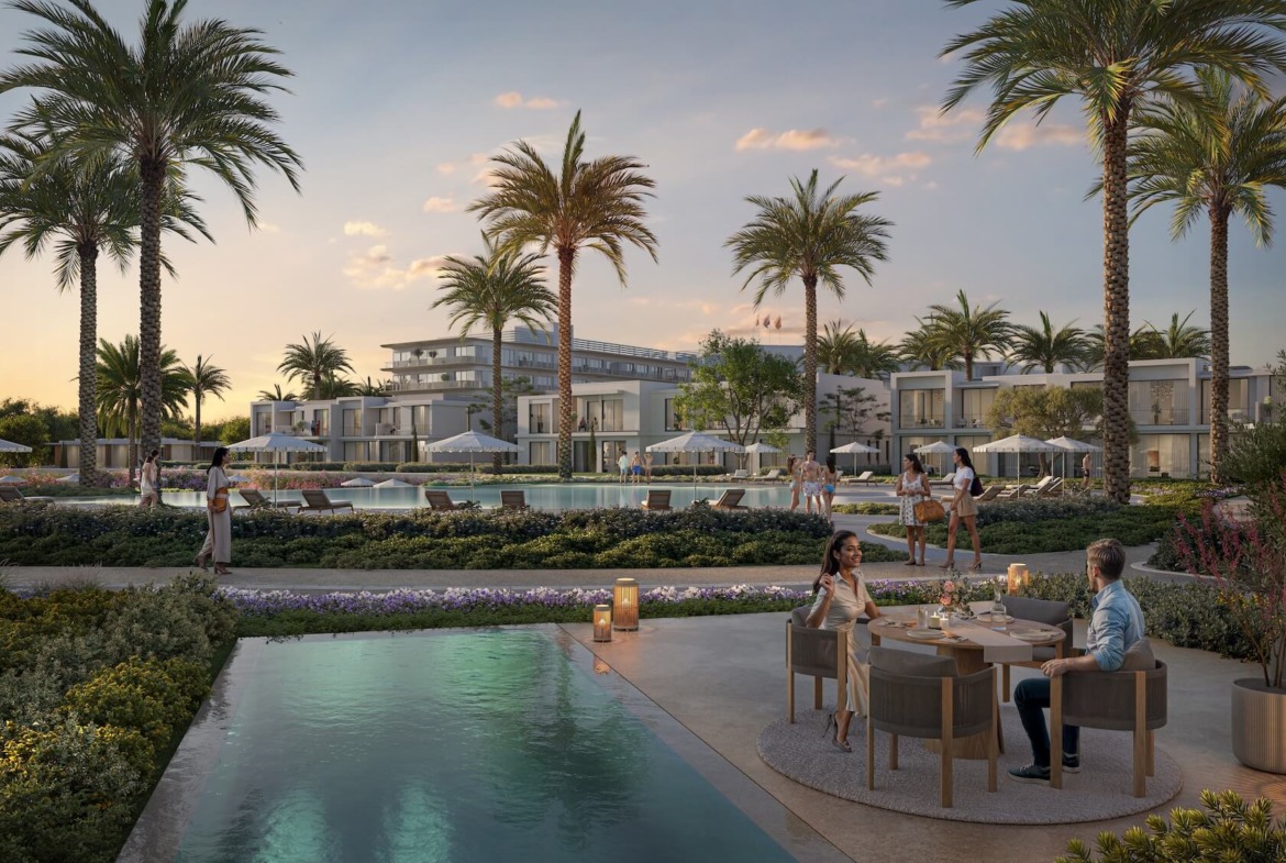 Couple dining beside a lagoon with palm trees at dusk - hotel apartment in Soul by Emaar, North Coast