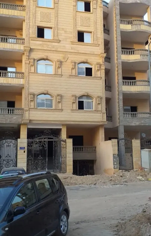 Apartment building under finishing with beige balconies - apartment in North Lotus, New Cairo