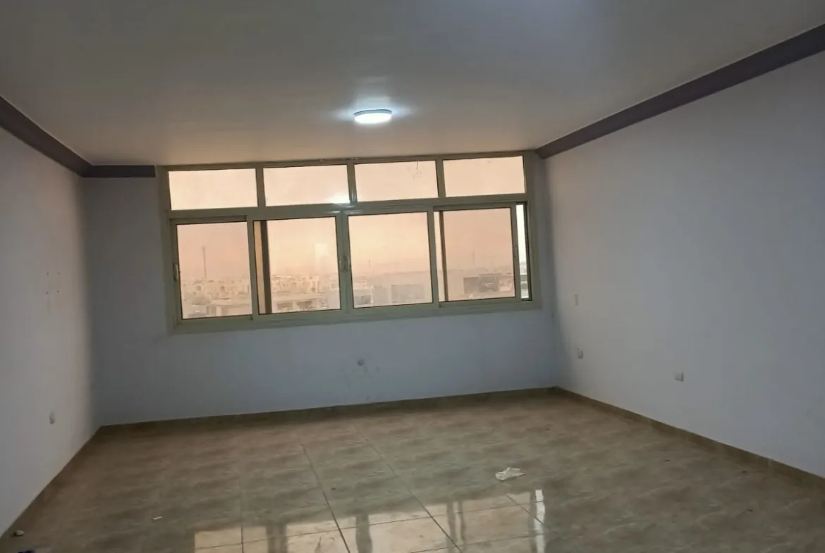 Empty room with a long window and a glossy floor - apartment in South Lotus on South 90th Street, New Cairo