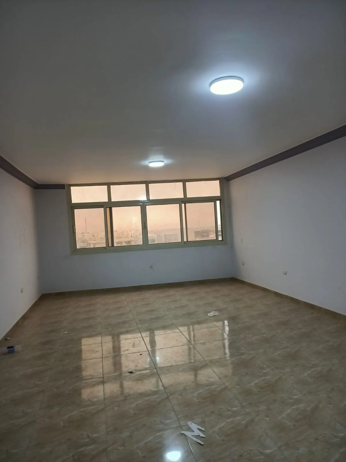 lotus-south-apt-223-ph5 Empty room with a long window and a glossy floor - apartment in South Lotus on South 90th Street, New Cairo
