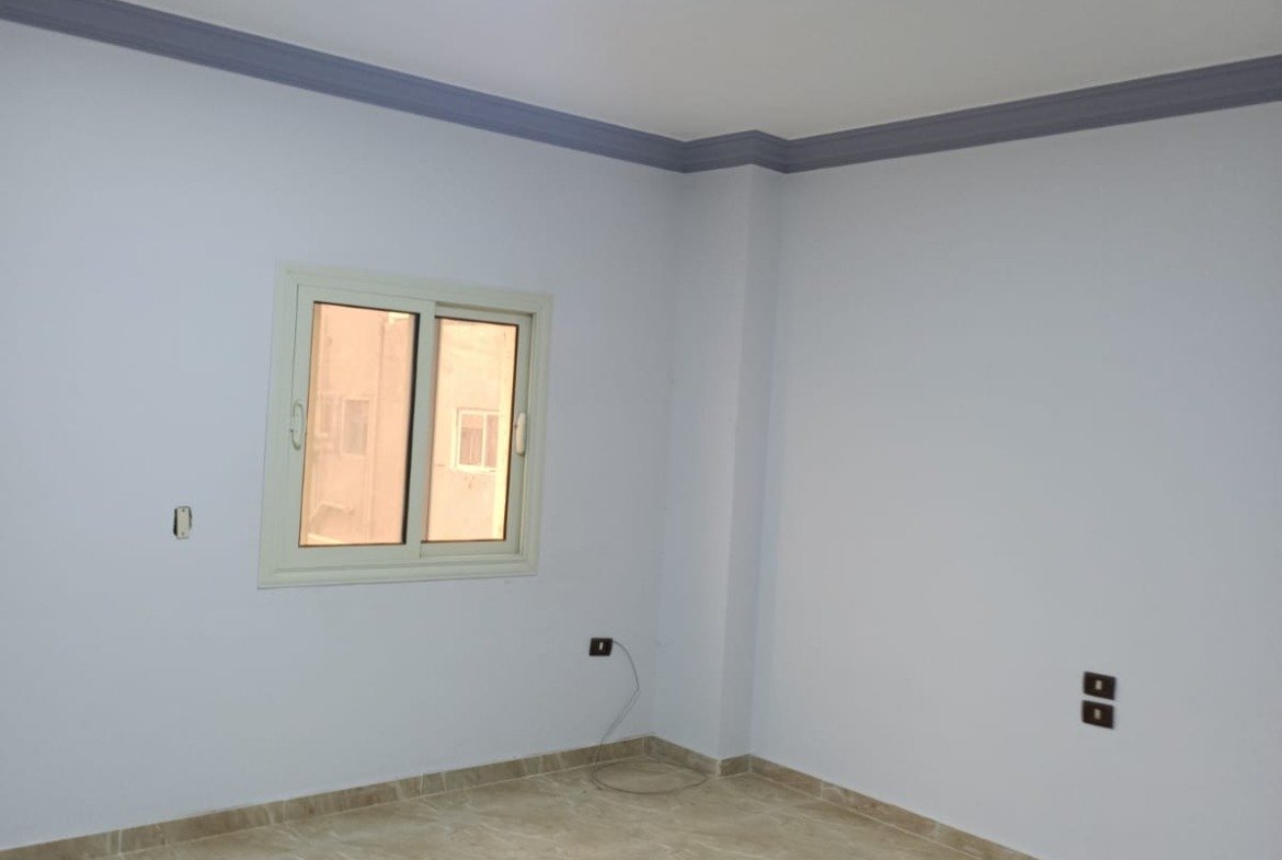 Empty room with a small window and ceiling light - apartment in South Lotus on South 90th Street, New Cairo