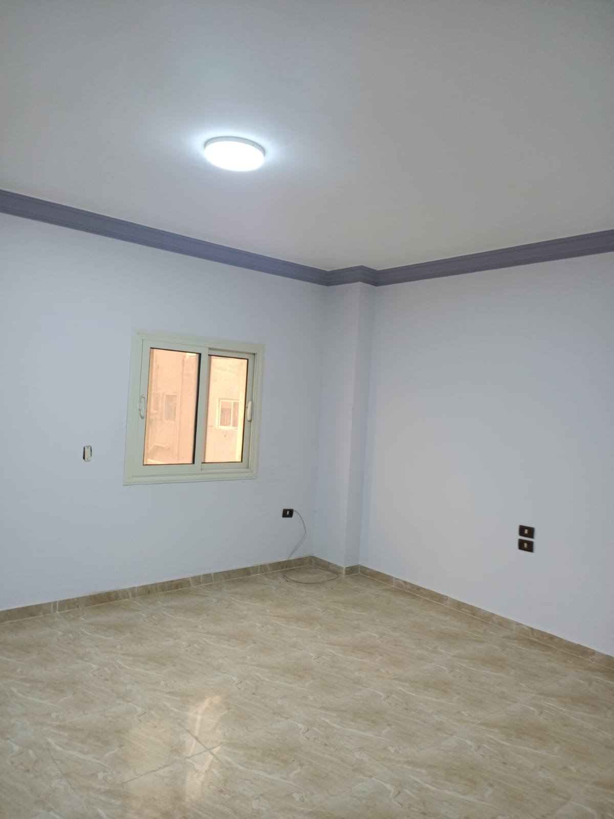 lotus-south-apt-223-ph9 Empty room with a small window and ceiling light - apartment in South Lotus on South 90th Street, New Cairo