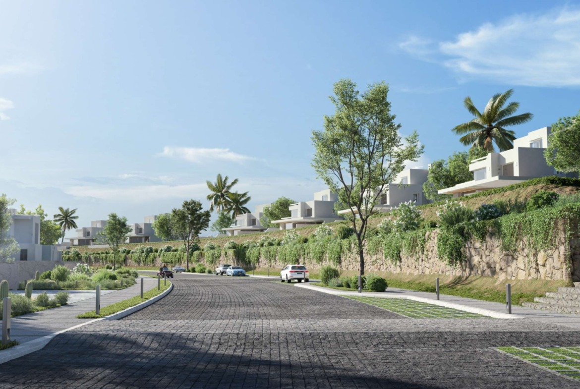 Landscaped road lined with trees and white villas - unit in LVLS Ras El Hekma, North Coast