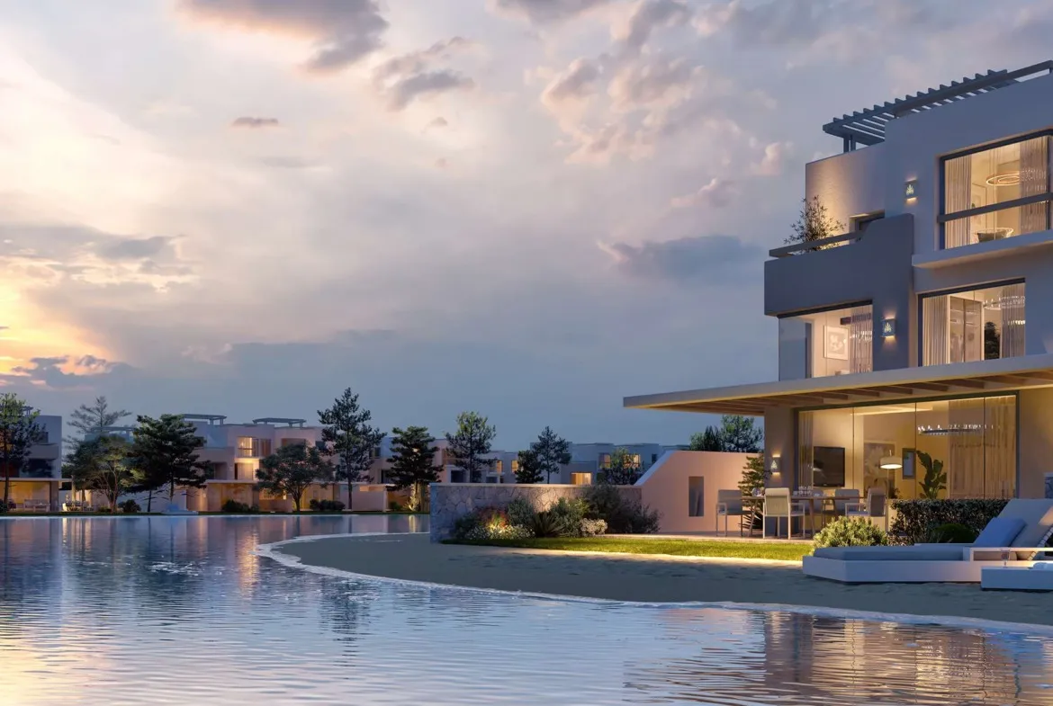 Villas around a lagoon at dusk - unit in LVLS Ras El Hekma, North Coast