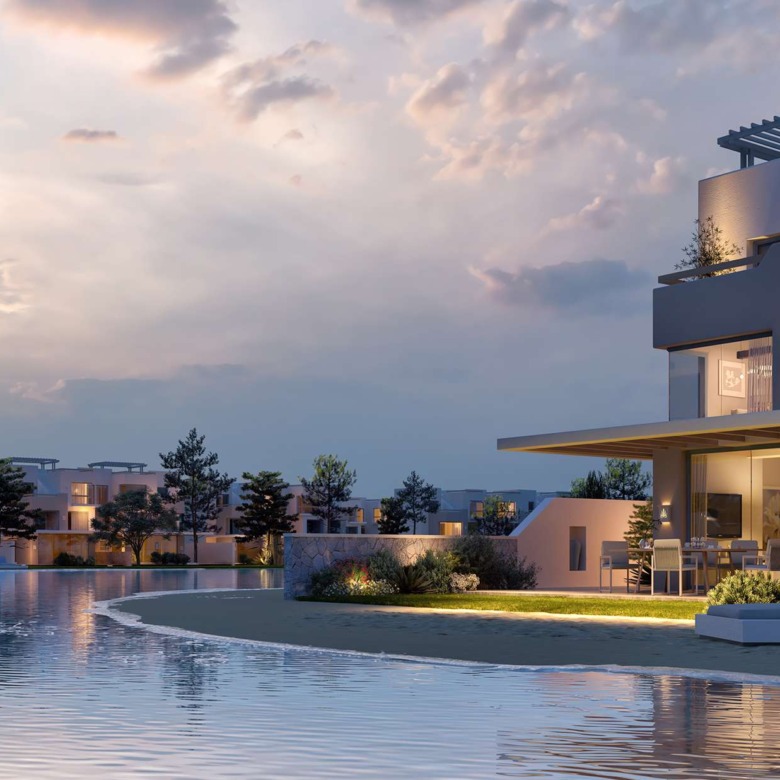 Villas around a lagoon at dusk - townhouse in LVLS, Ras El Hekma, North Coast