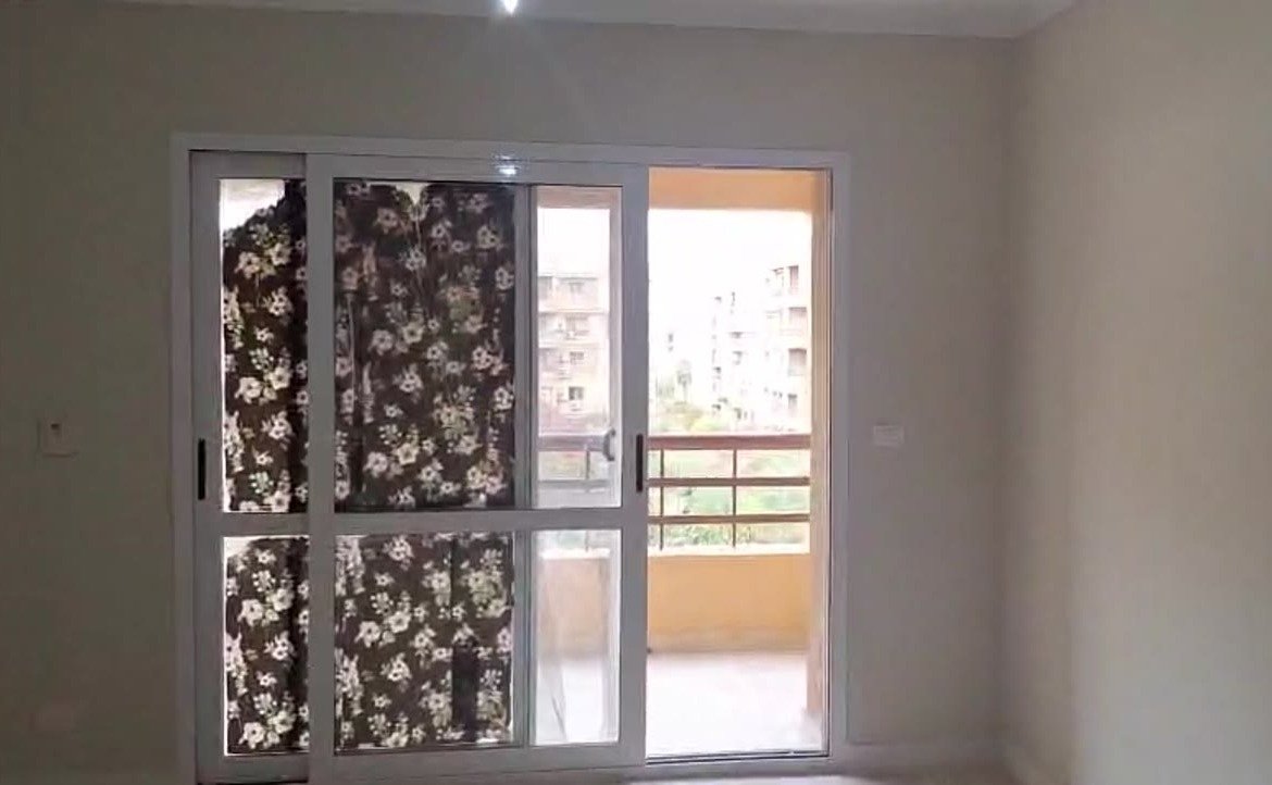 Sliding balcony door with a floral privacy film - apartment in Madinaty – 3 Bedrooms 105 sqm Garden View Catch Price, New Cairo