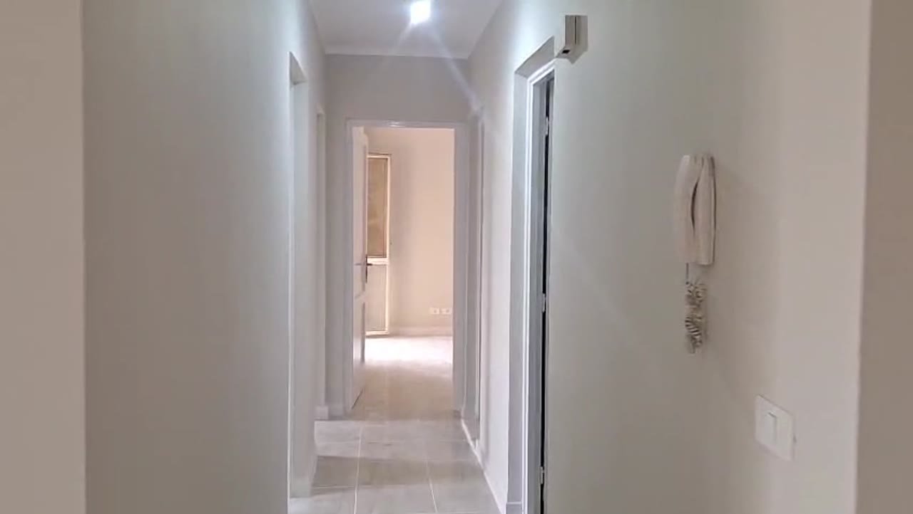 Hallway with an intercom and rooms at the end - apartment in Madinaty – 3 Bedrooms 105 sqm Garden View Catch Price, New Cairo