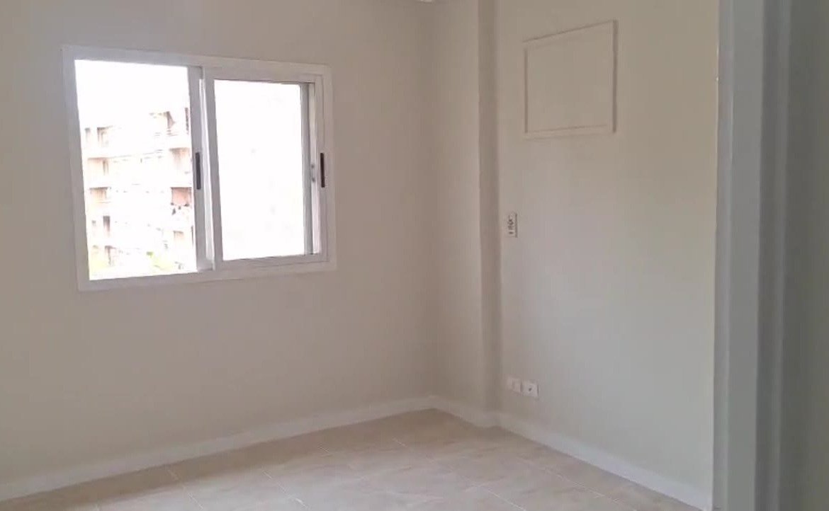 Empty room with a sliding window and white walls - apartment in Madinaty – 3 Bedrooms 105 sqm Garden View Catch Price, New Cairo