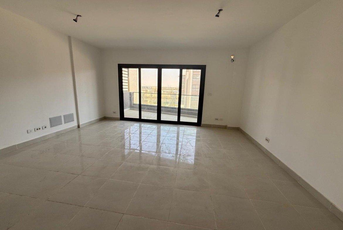 Apartment for sale in Madinaty B15 New Cairo - living room with balcony doors
