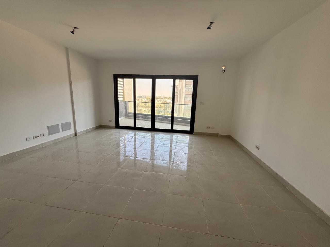Apartment for sale in Madinaty B15 New Cairo - living room with balcony doors