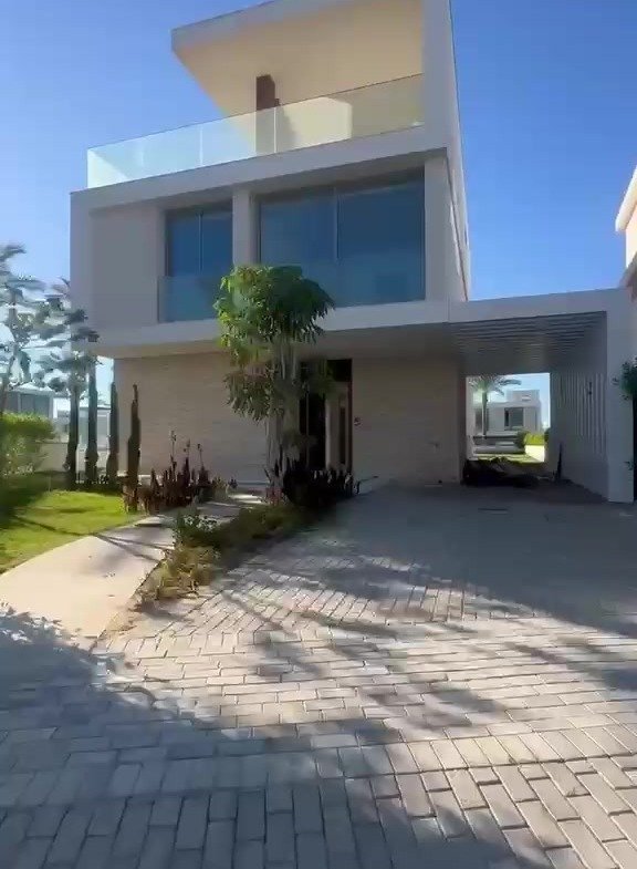 Villa facade with roof terrace and paved driveway - villa in Marassi Bay, North Coast