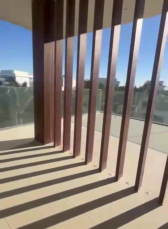 Terrace with wooden vertical slats and shadows - villa in Marassi Bay, North Coast