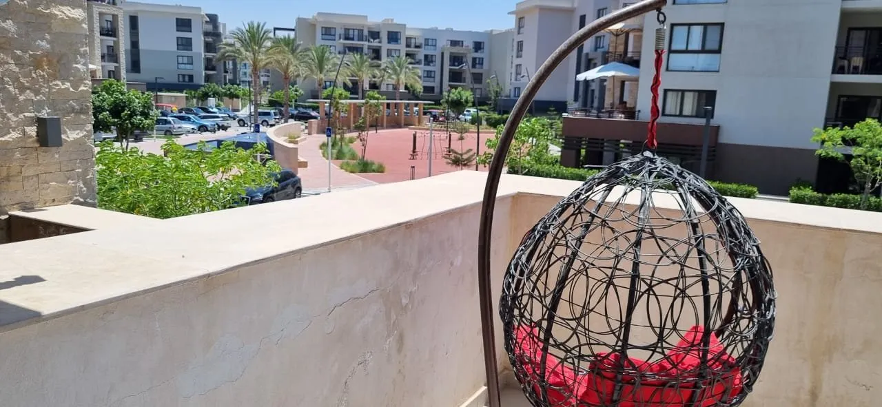 Hanging egg chair on the terrace with courtyard view - chalet in Marassi Marina 1, North Coast