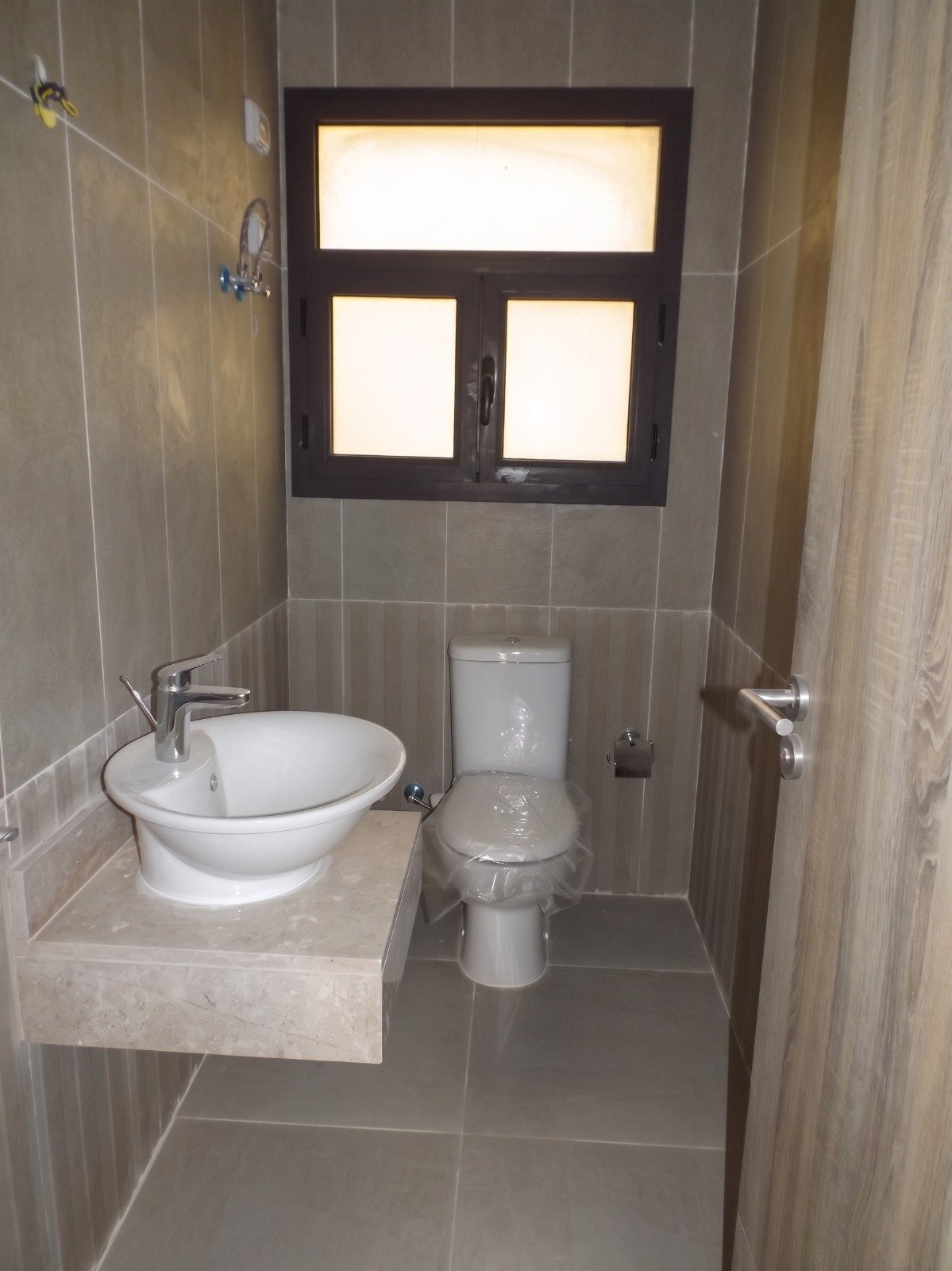 moon-residences-5th-square-bathroom-2 Bathroom with round washbasin and toilet - apartment in Moon Residence, Fifth Square, New Cairo