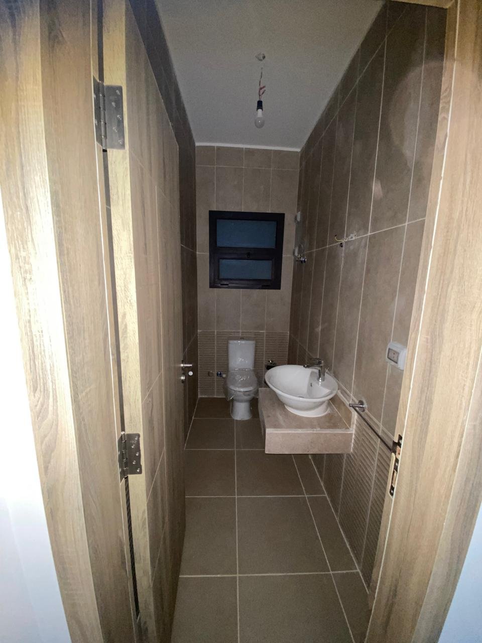 Bathroom with washbasin and toilet - apartment in Moon Residence, Fifth Square, New Cairo