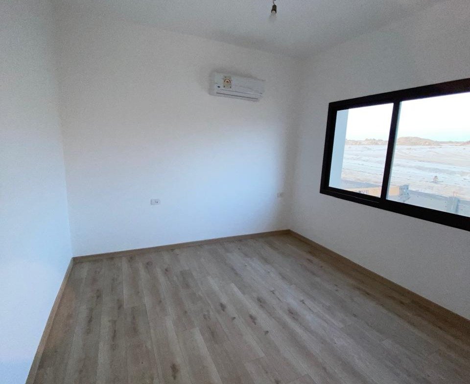 Empty room with window and air conditioner - apartment in Moon Residence, Fifth Square, New Cairo