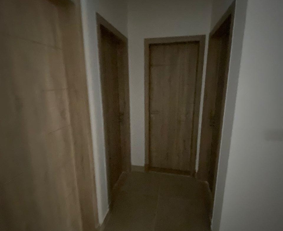 Hallway with wooden doors - apartment in Moon Residence, Fifth Square, New Cairo