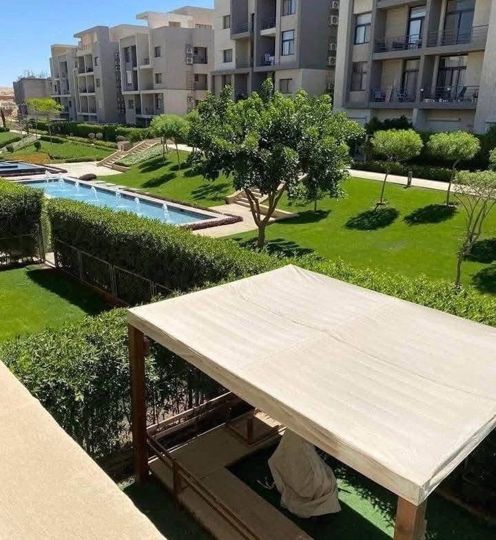 Garden with outdoor pergola seating - apartment in Moon Residence, Fifth Square, New Cairo
