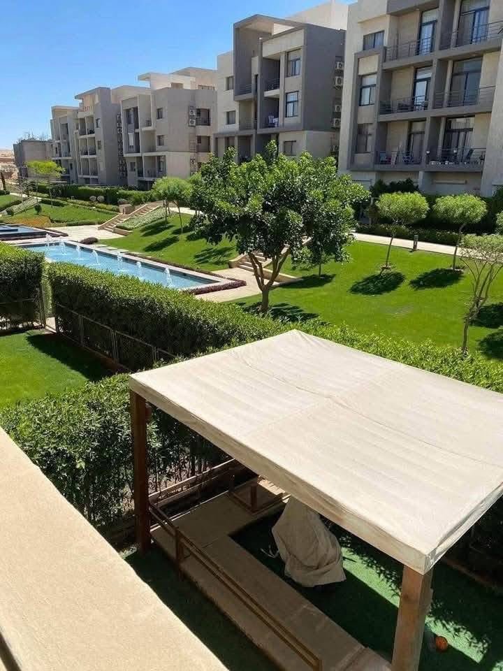 Garden with outdoor pergola seating - apartment in Moon Residence, Fifth Square, New Cairo