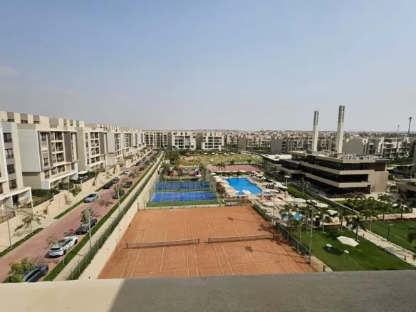 Club House and pool view from Sky Loft penthouse roof in Moon Residences Fifth Square New Cairo