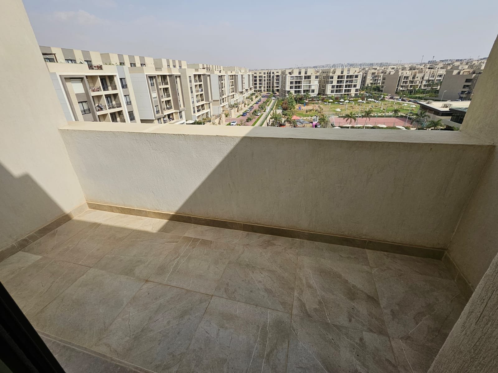 Terrace overlooking the compound - sky loft in Moon Residence, Fifth Square, New Cairo
