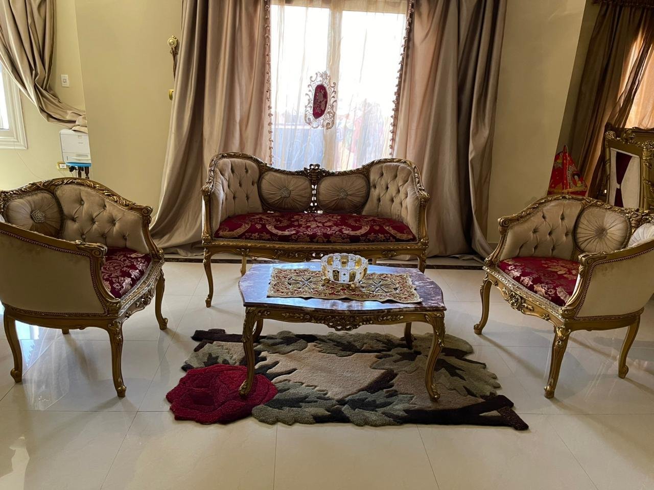 mostasharin-apt-221-ph3 Gilded living room set with burgundy cushions and a coffee table - apartment in South Investors 2, 5th Settlement