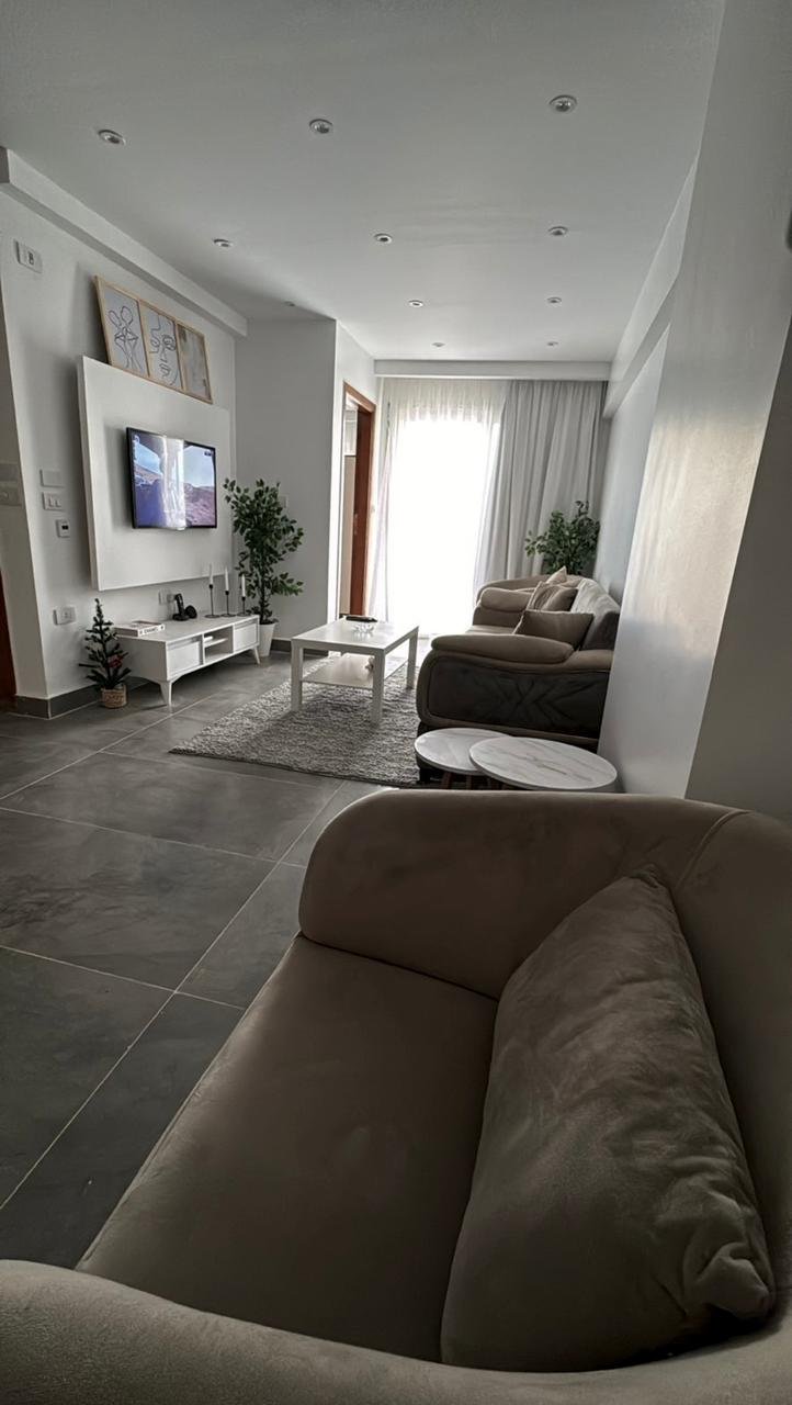 mvic525-u10 Living room view from the armchair toward the balcony - apartment in Mountain View iCity, New Cairo