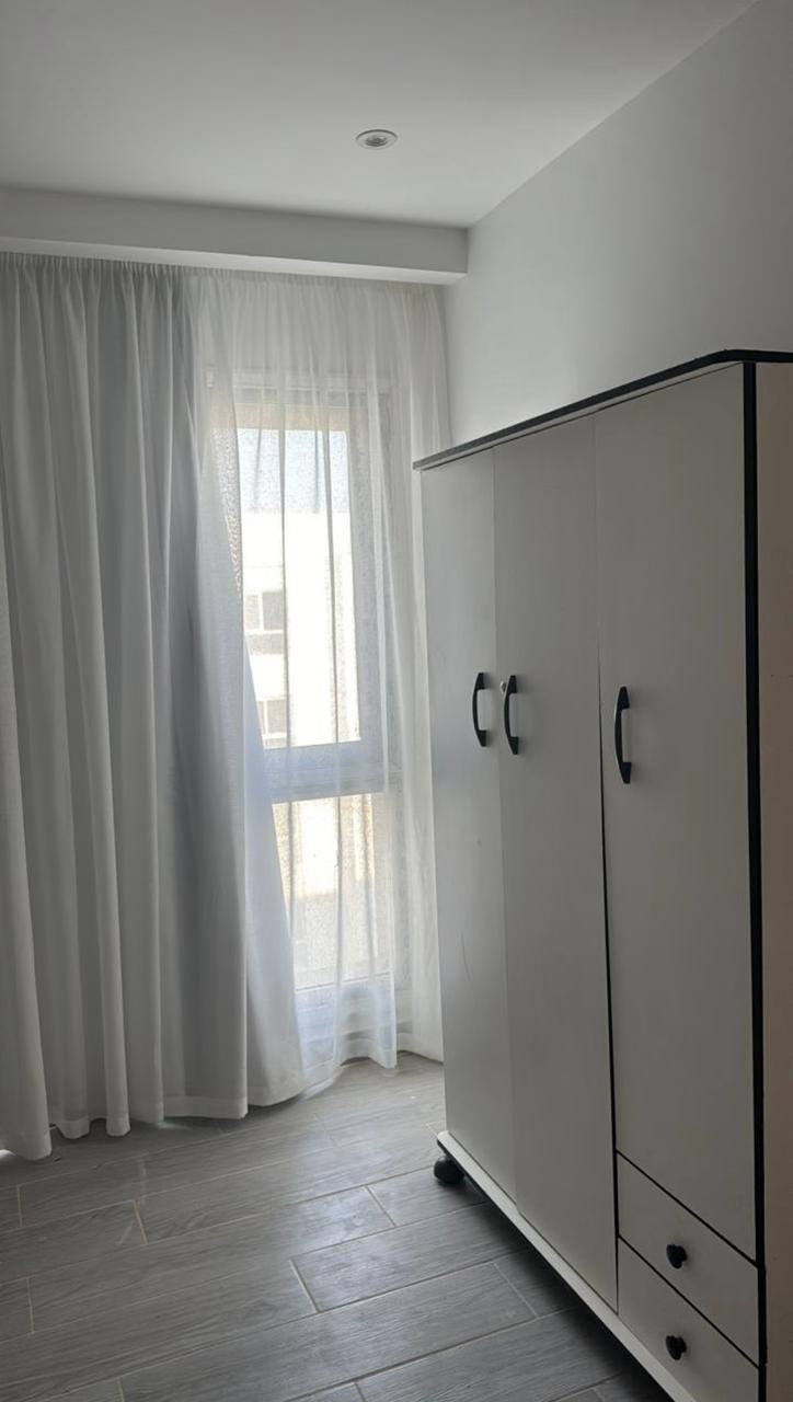 mvic525-u16 Wardrobe beside a window with white curtains - apartment in Mountain View iCity, New Cairo