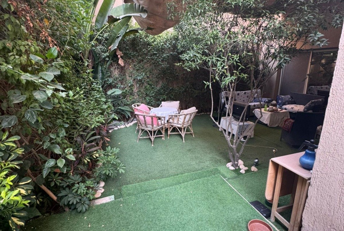 Small garden terrace with plants and a bistro set - duplex in One Piece, New Cairo