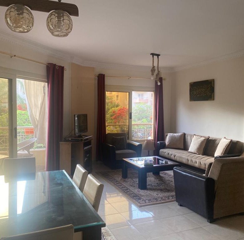 Living and reception area with main street view - furnished apartment for rent in Opera City Sheikh Zayed