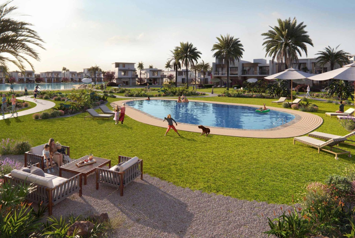 Landscaped pool garden with seating and parasols - chalet in Ora, North Coast