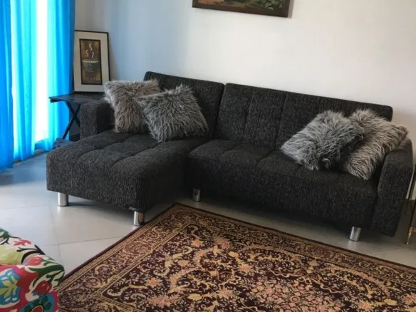 Furnished living room with air conditioner in 3 bedroom apartment for rent in Park View New Cairo