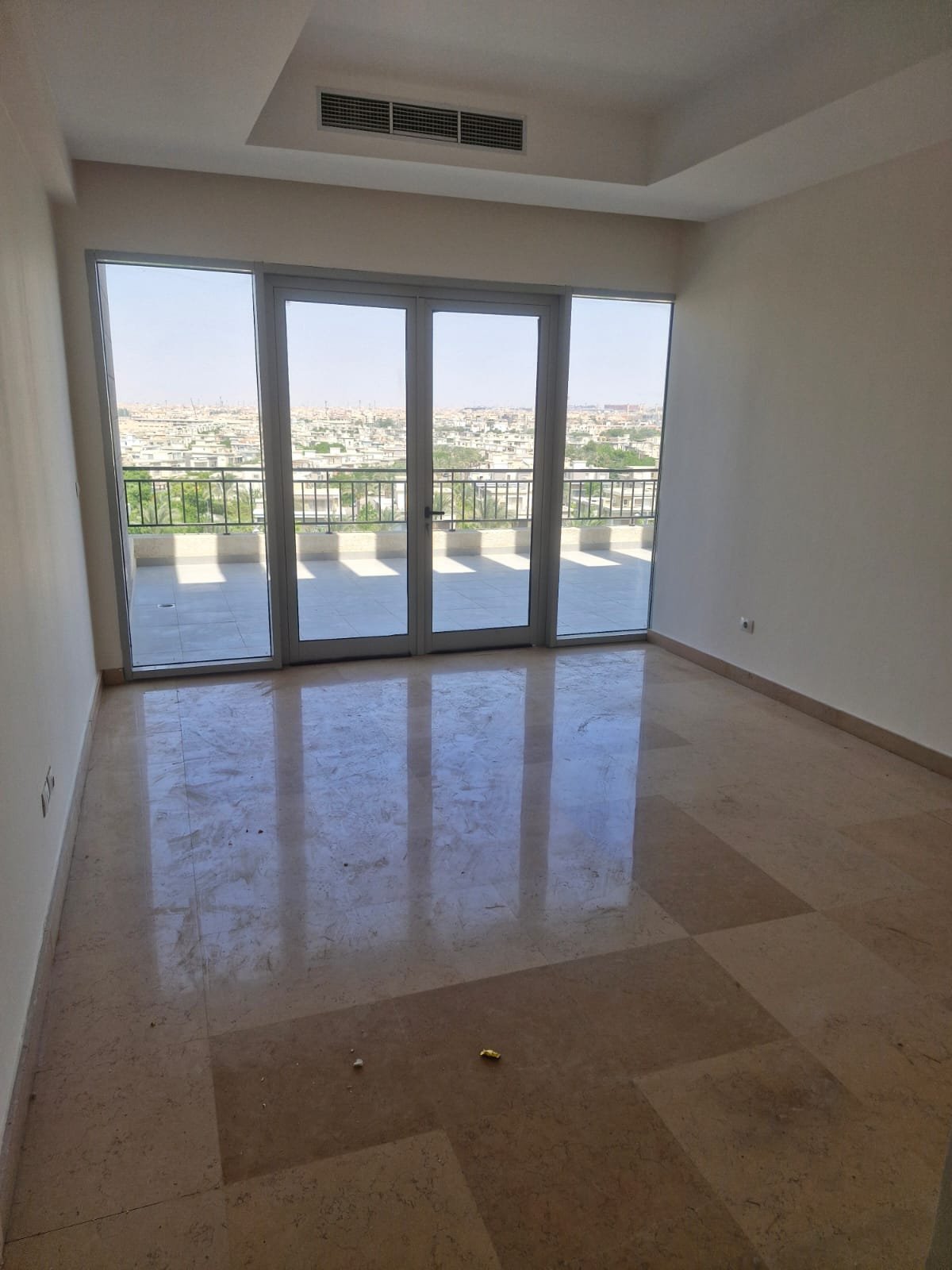 penthouse-for-rent-cfc-new-cairo-378-sqm-332-master-room Marble-floored room with glass doors to the terrace - penthouse in Cairo Festival City, New Cairo