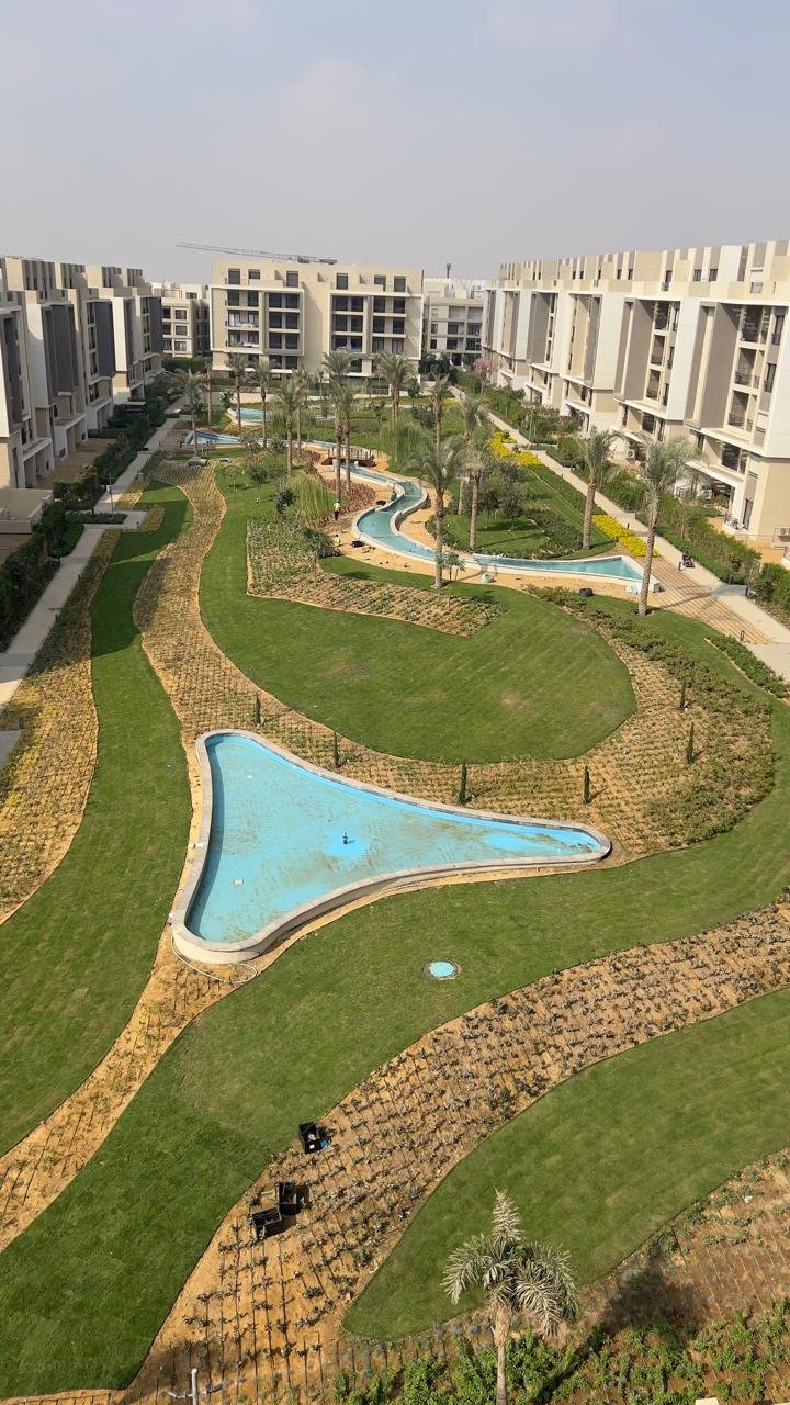 Lagoon pool and gardens seen from above - penthouse in Fifth Square, New Cairo