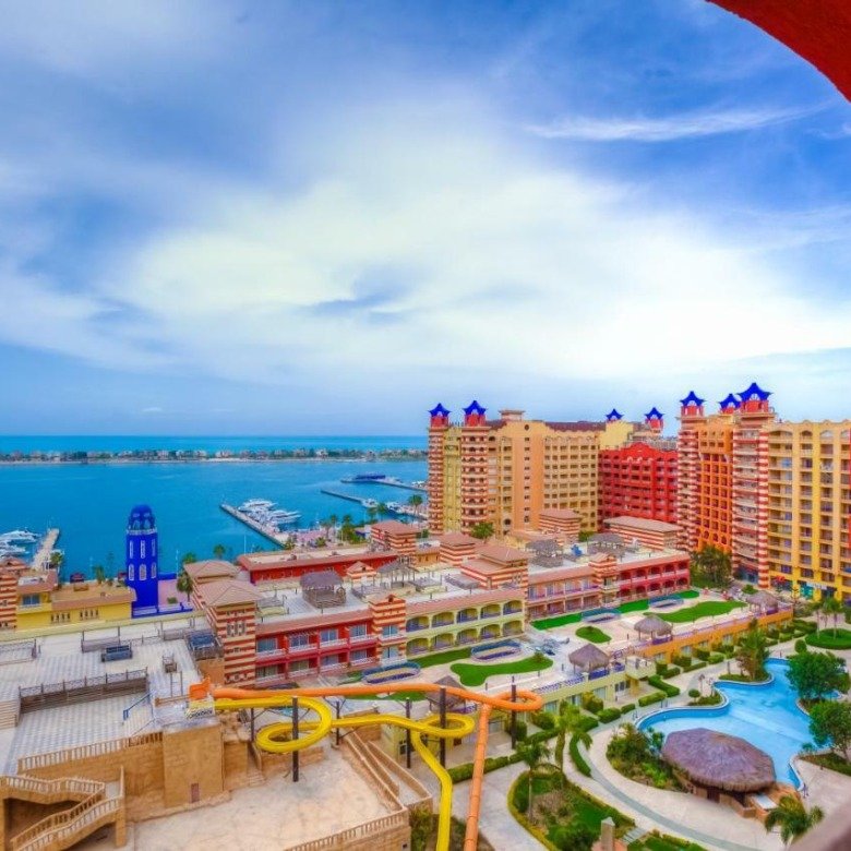 Buildings and waterfront at Porto Marina chalet resort, North Coast