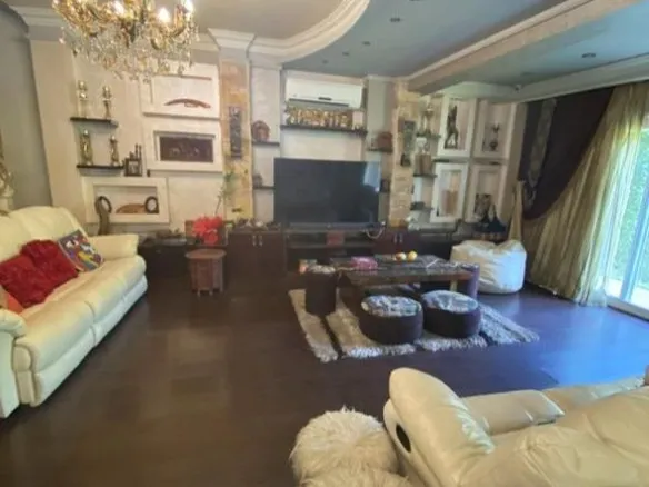 Living room with television and garden doors - Al Rehab 2, New Cairo twinhouse
