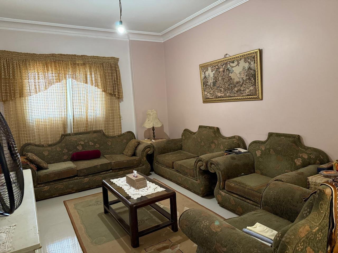 roof-for-sale-al-banafseg-2-new-cairo-210-sqm-terrace-living-2 Second seating area with green sofas, roof in Al Banafseg New Cairo - ركنة جلوس ثانية بأنتريه أخضر، روف في البنفسج القاهرة الجديدة